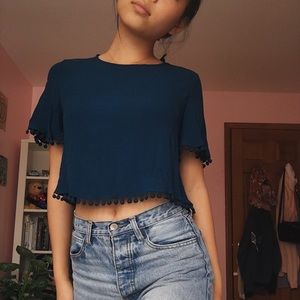 cropped blouse with pom poms